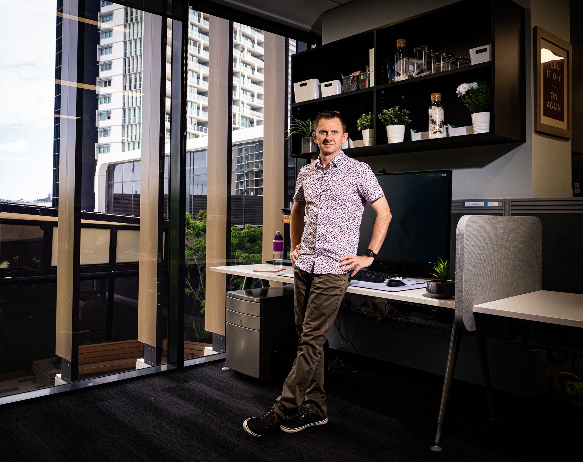Scott Sheppeard working in a bright office